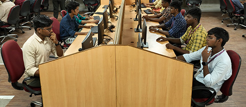 students working in desktops